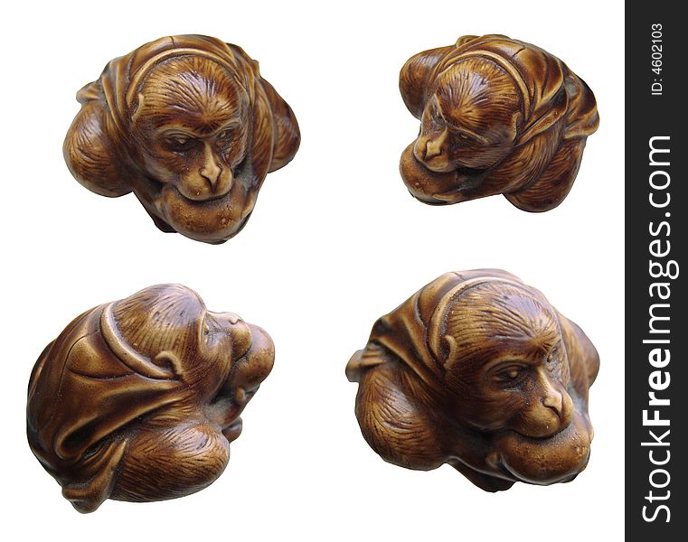 Small brown souvenir figurine of the monkey with an apple