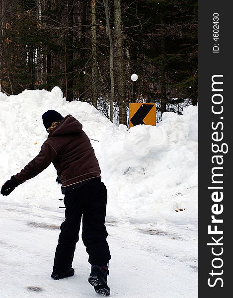 Target Practice takes on many forms including firing snowballs at road signs on a quiet country lane, Ontario. Target Practice takes on many forms including firing snowballs at road signs on a quiet country lane, Ontario