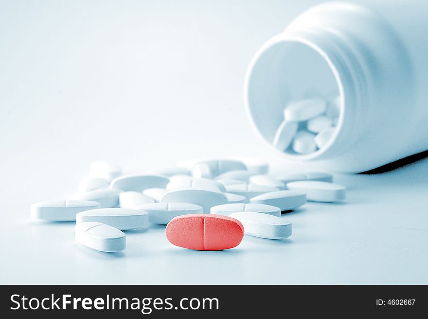 White tablets with bottle on background. White tablets with bottle on background