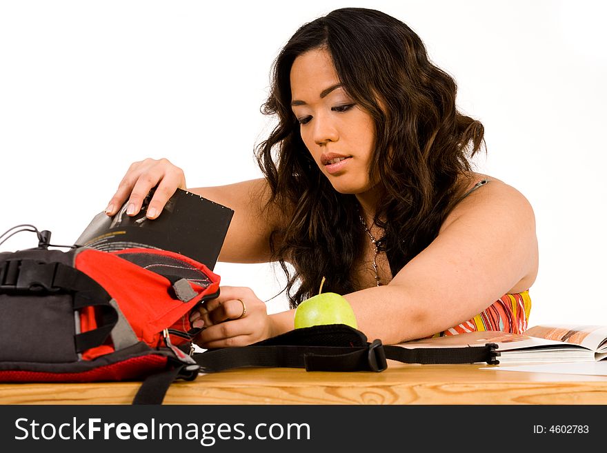 Student is ordening her books