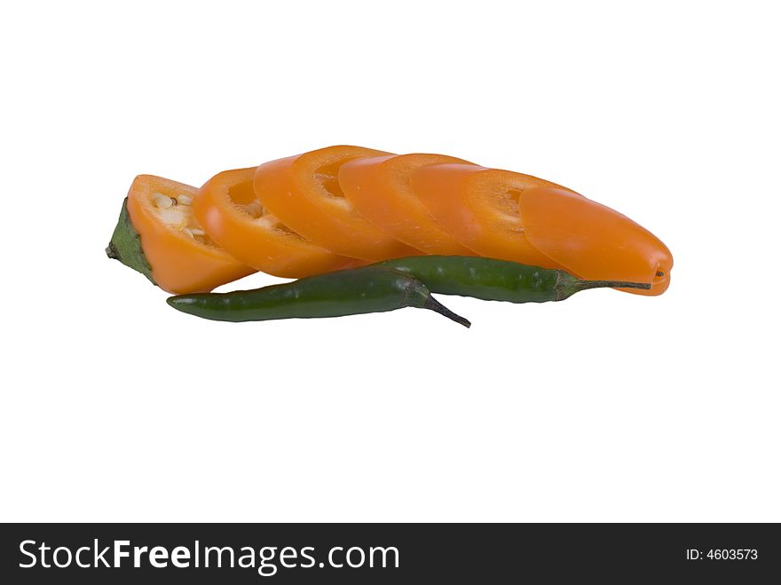 Orange chilli, sliced and isolated on white with grren chillis in front. Includes clipping path. Orange chilli, sliced and isolated on white with grren chillis in front. Includes clipping path