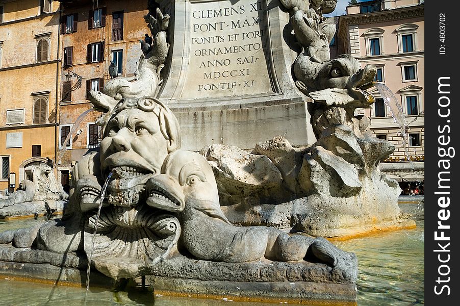 Close-up on a fountain in the city square in front of the Roman Pantheon. Close-up on a fountain in the city square in front of the Roman Pantheon