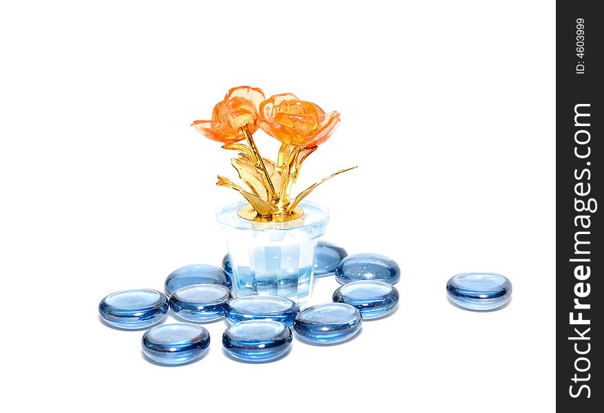 Orange glass flower with blue glass stones. Orange glass flower with blue glass stones