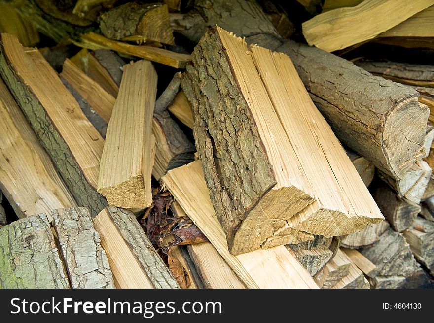 Mixed stack of split fire wood. Mixed stack of split fire wood