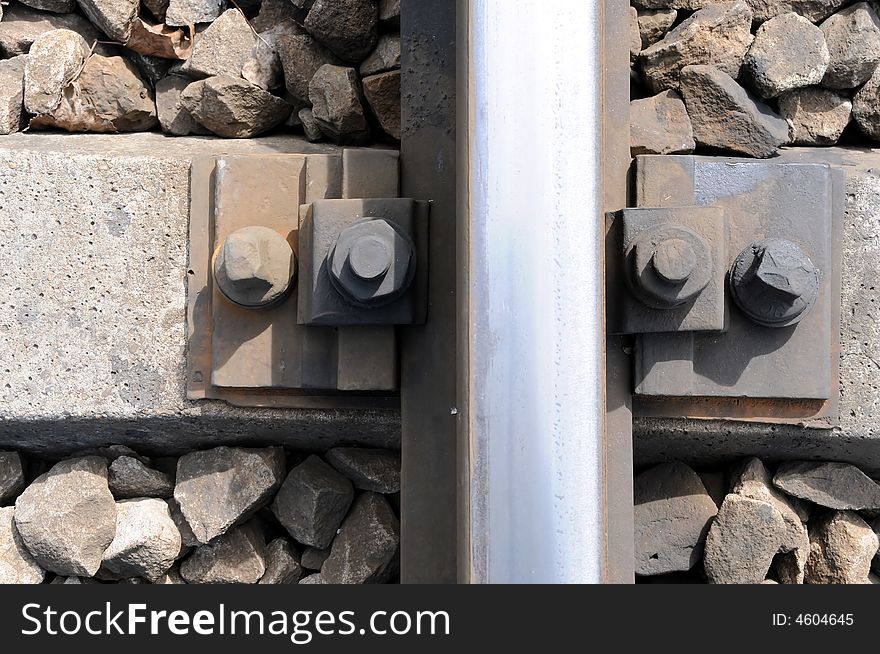 Closeup of iron railroad track on sleeper. Closeup of iron railroad track on sleeper