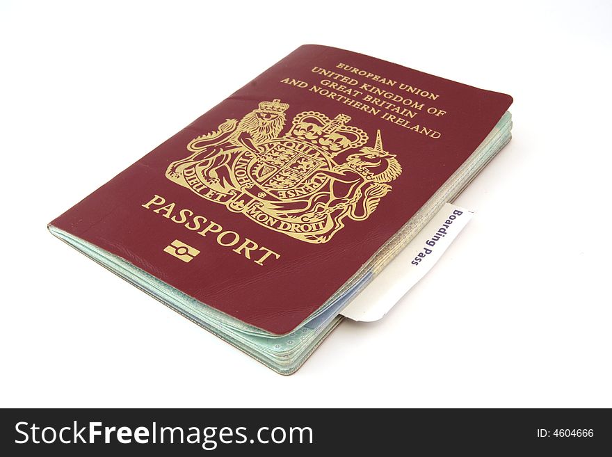 A passport with a boarding card protruding. A passport with a boarding card protruding