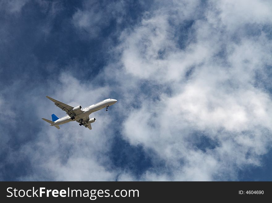 Generic jet airliner in a beautiful cloudy sky