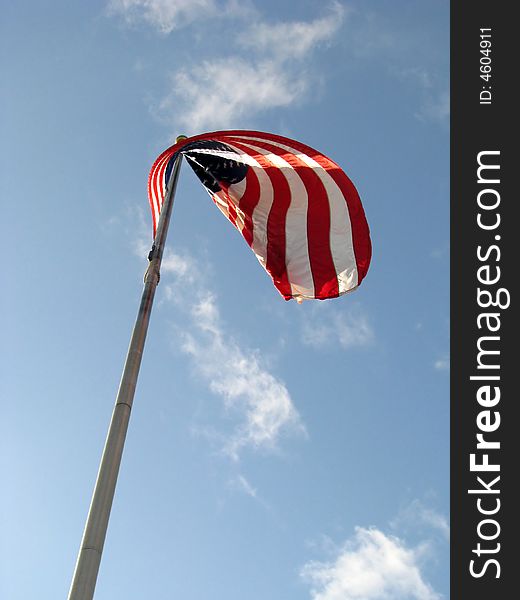 American Flag v1 with Red White and Blue colors set against a blue sky with white clouds.