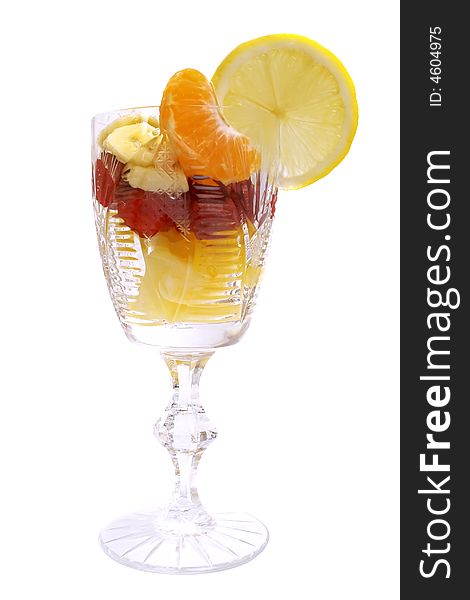 Fruits salad in the cup isolated on white. Fruits salad in the cup isolated on white