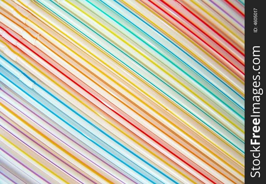 Close-up diagonal pattern of colorful straws, colorful background. Close-up diagonal pattern of colorful straws, colorful background