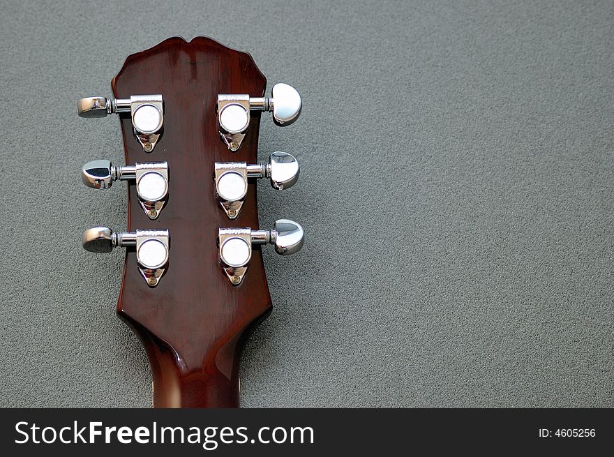 Tuning machines on a Les Paul guitar neck. Tuning machines on a Les Paul guitar neck