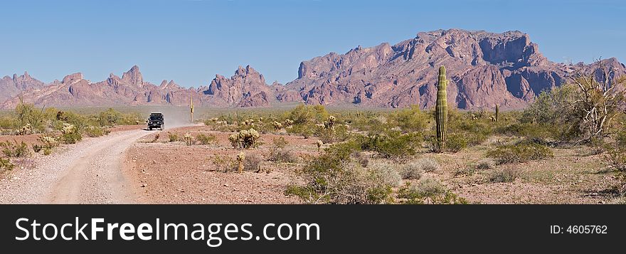 Dirt road with Kofa Mountains in background.