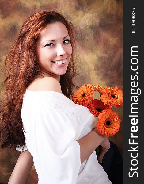 Beautyful young girl with bunch of flowers. Beautyful young girl with bunch of flowers