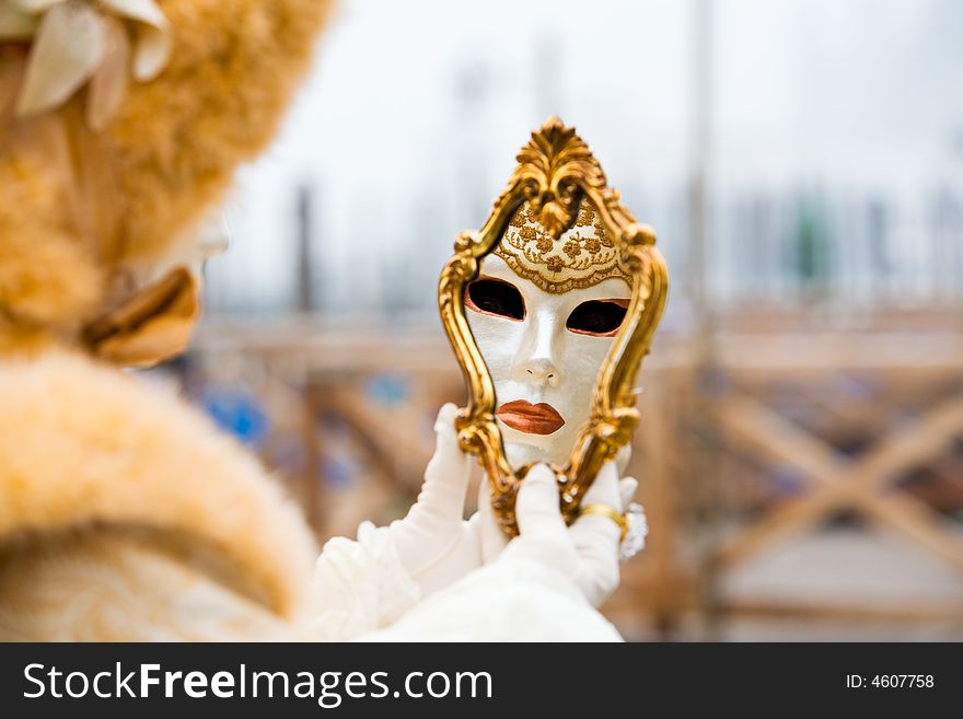 A venetian mask reflected in a mirror. A venetian mask reflected in a mirror