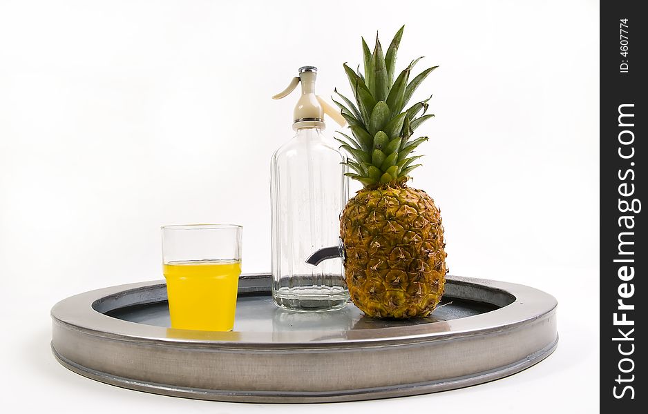 Juicy ananas with soda bottle