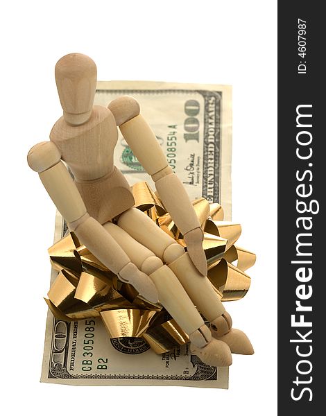 Manikin sitting on a gift wrapped money