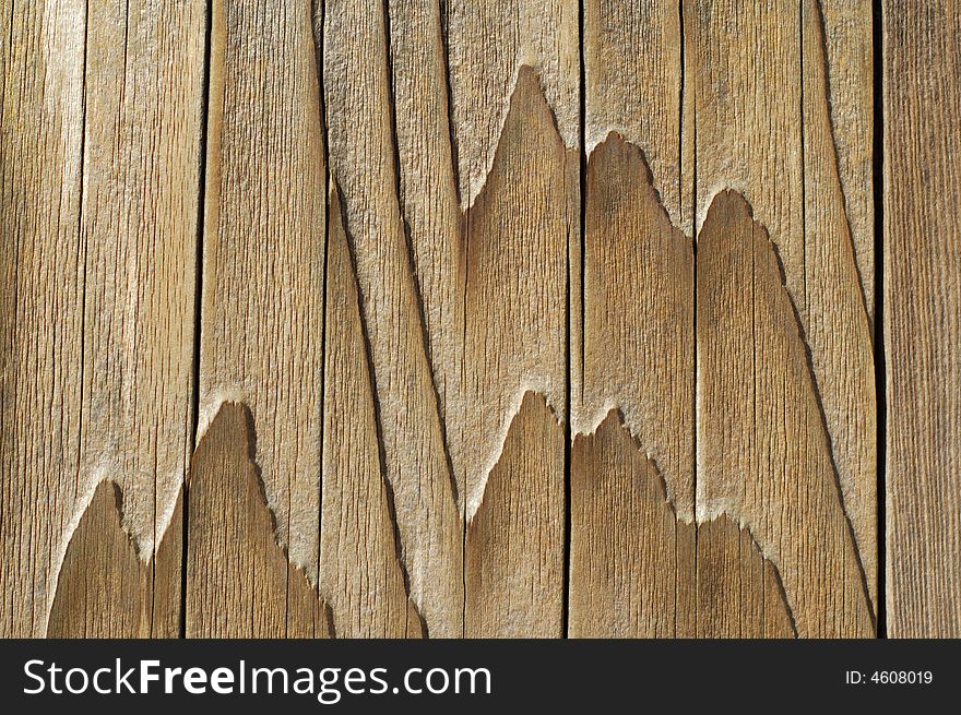 Weathered wood siding resembles a mountain landscape. Weathered wood siding resembles a mountain landscape