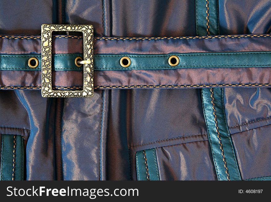 Belt with metal buckle on jacket