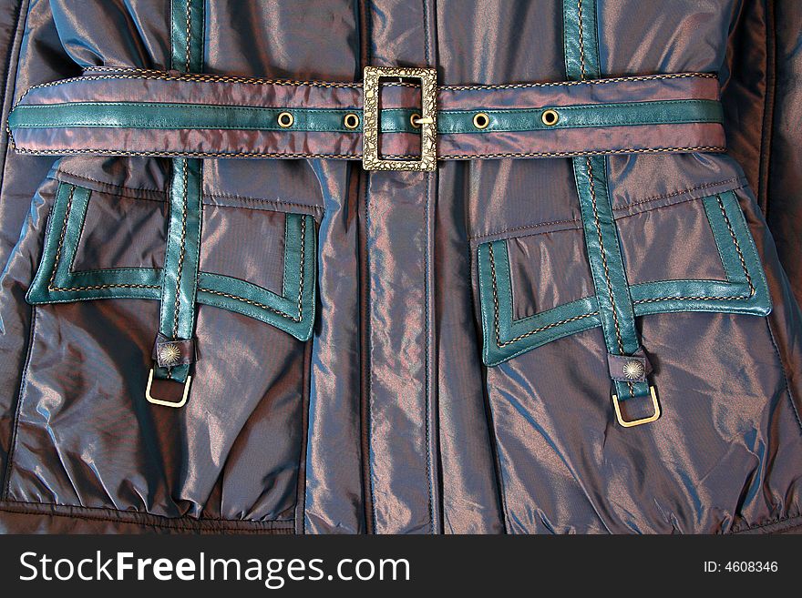 Belt and pocket with metal buckle on jacket