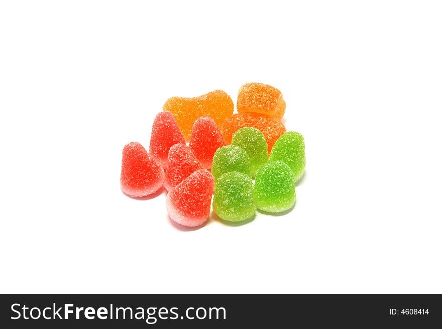 Bright colorful candies consisting of the colours red, orange and green.