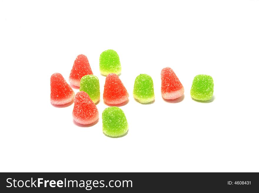 Bright colorful candies forming a left arrow.