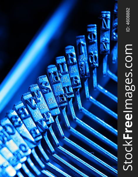 Letters of russian typewriter in blue light