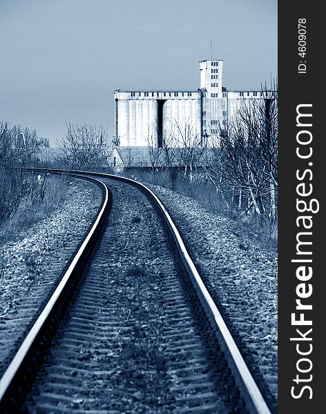 A vertical shot of railroad tracks extending to the horizon.