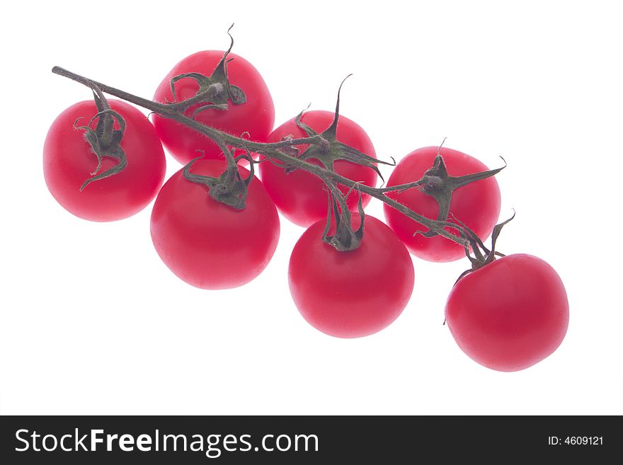 Bunch of cherry tomatoes isolated on white. Bunch of cherry tomatoes isolated on white