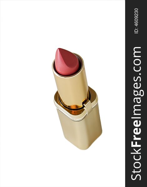 Red lipstick in golden colored tube isolated on white. Red lipstick in golden colored tube isolated on white