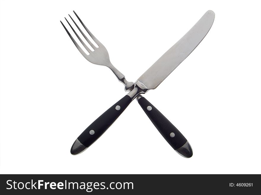 Fork and knife crossed on white background