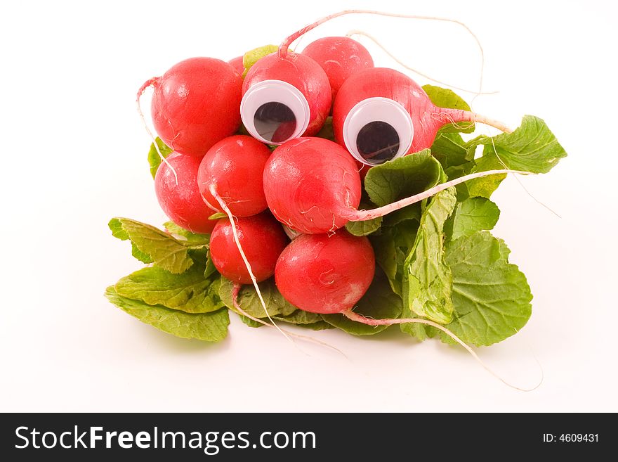 Googly eyes radishes sit on a white background. Googly eyes radishes sit on a white background.