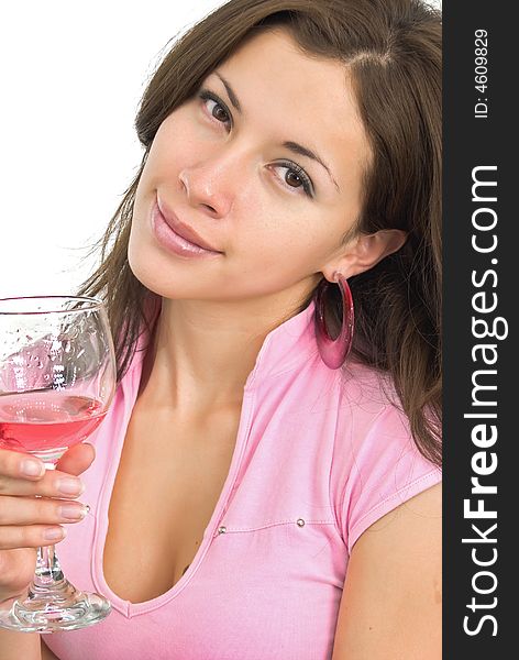 Smiling nice girl in pink with pink wine in wineglass