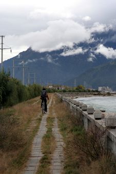 Cycling By The Riverside In Deep Tibet Valley Stock Image