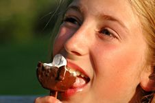 Girl Eating Ice-cream Stock Images