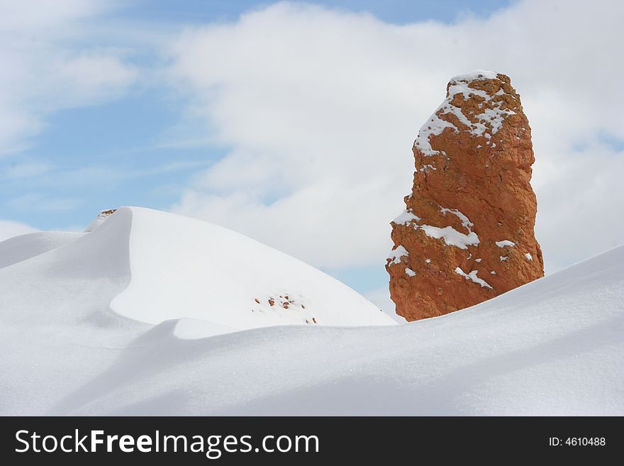 Roxk and snow reach the blue sky in Bryce Canyon West USA. Roxk and snow reach the blue sky in Bryce Canyon West USA