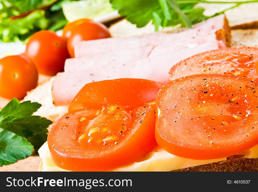 Tomatoes, ham and cheese sandwiches. Tomatoes, ham and cheese sandwiches