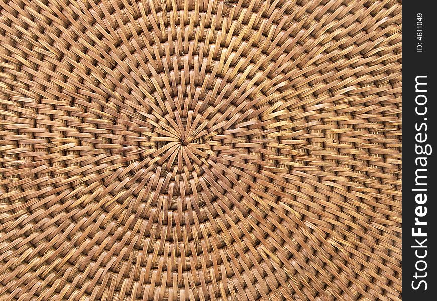 Round weaving from rattan, on a white background