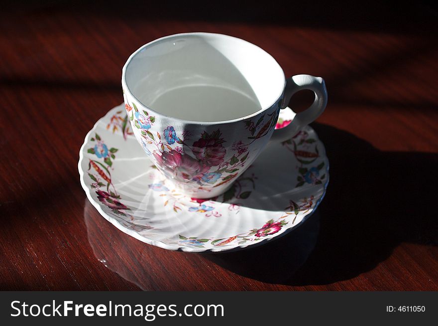 Fine china teacup on a wooden table