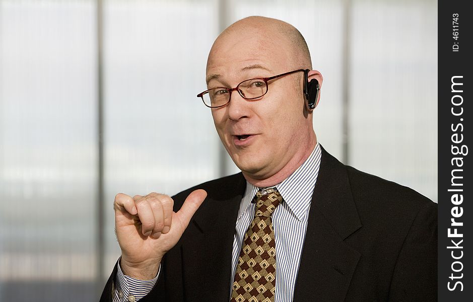 Businessman with a hands-free phone