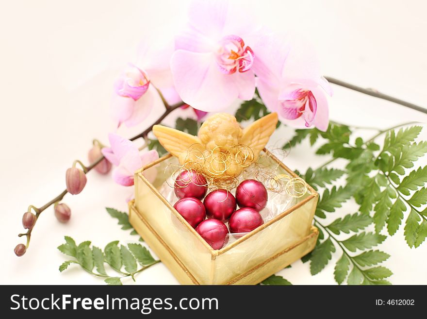Soap and perfumeв oil in the box with tender orchids. Soap and perfumeв oil in the box with tender orchids
