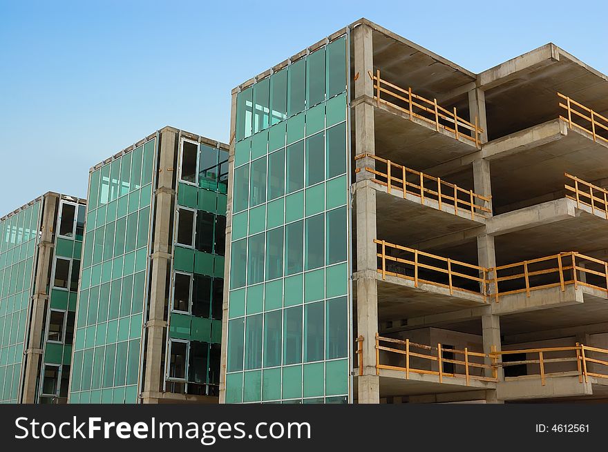 Few uncomplete houses from glass and concrete