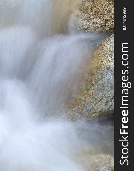 Long exposure photo of running water over rocks. Long exposure photo of running water over rocks