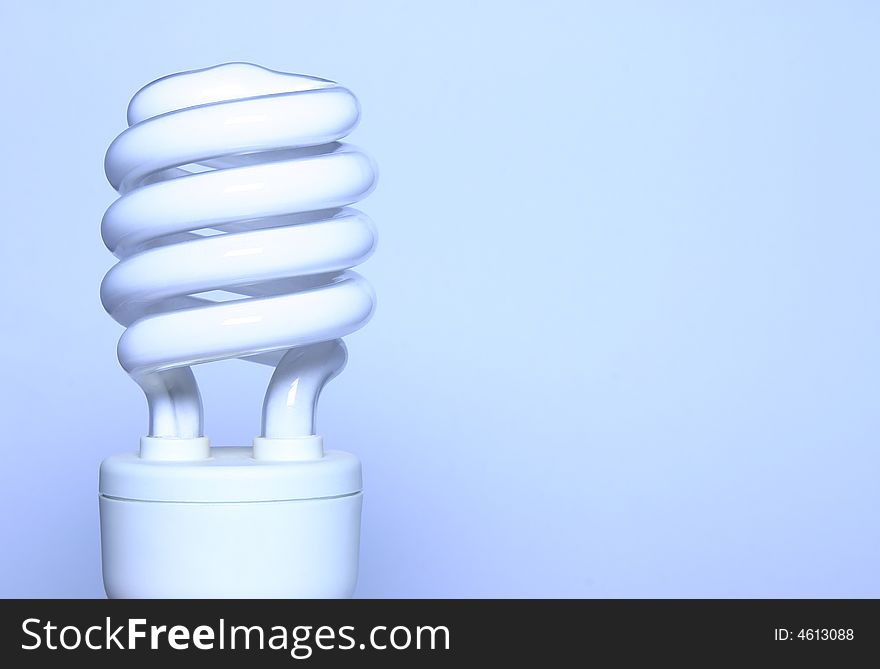 - an energy saving light bulb with room for text; shot in a light tent; blue toning derives from white balance setting artificial light. - an energy saving light bulb with room for text; shot in a light tent; blue toning derives from white balance setting artificial light