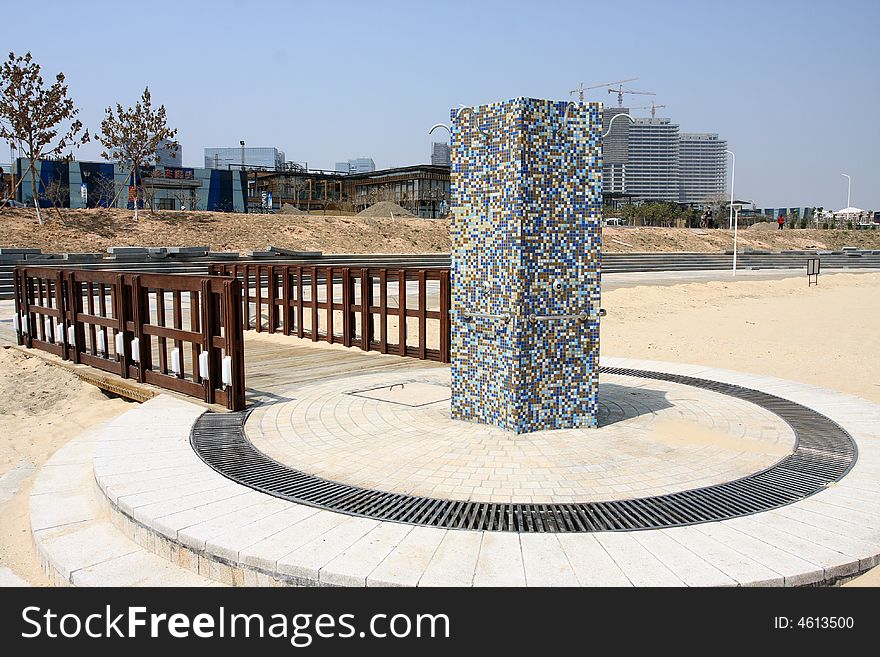 A shower station set on a public beach.