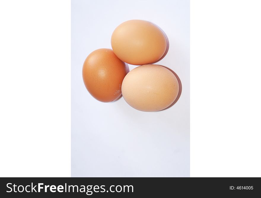 Three fresh eggs on white background