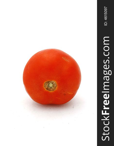 A fresh tomato isolated on a white background