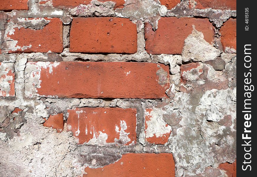 Wall of old red bricks with plaster rests. Wall of old red bricks with plaster rests
