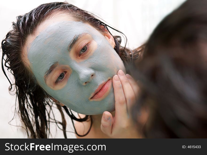 Woman Putting A Mud Mask