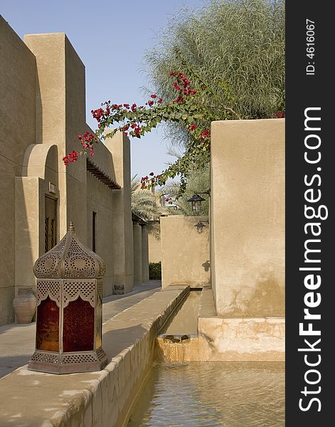 Arabic village lane with water stream and old arabic lamp. Arabic village lane with water stream and old arabic lamp