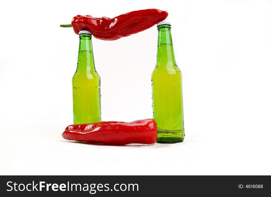 Combination of cold beer and spicy chili paprika's. Combination of cold beer and spicy chili paprika's